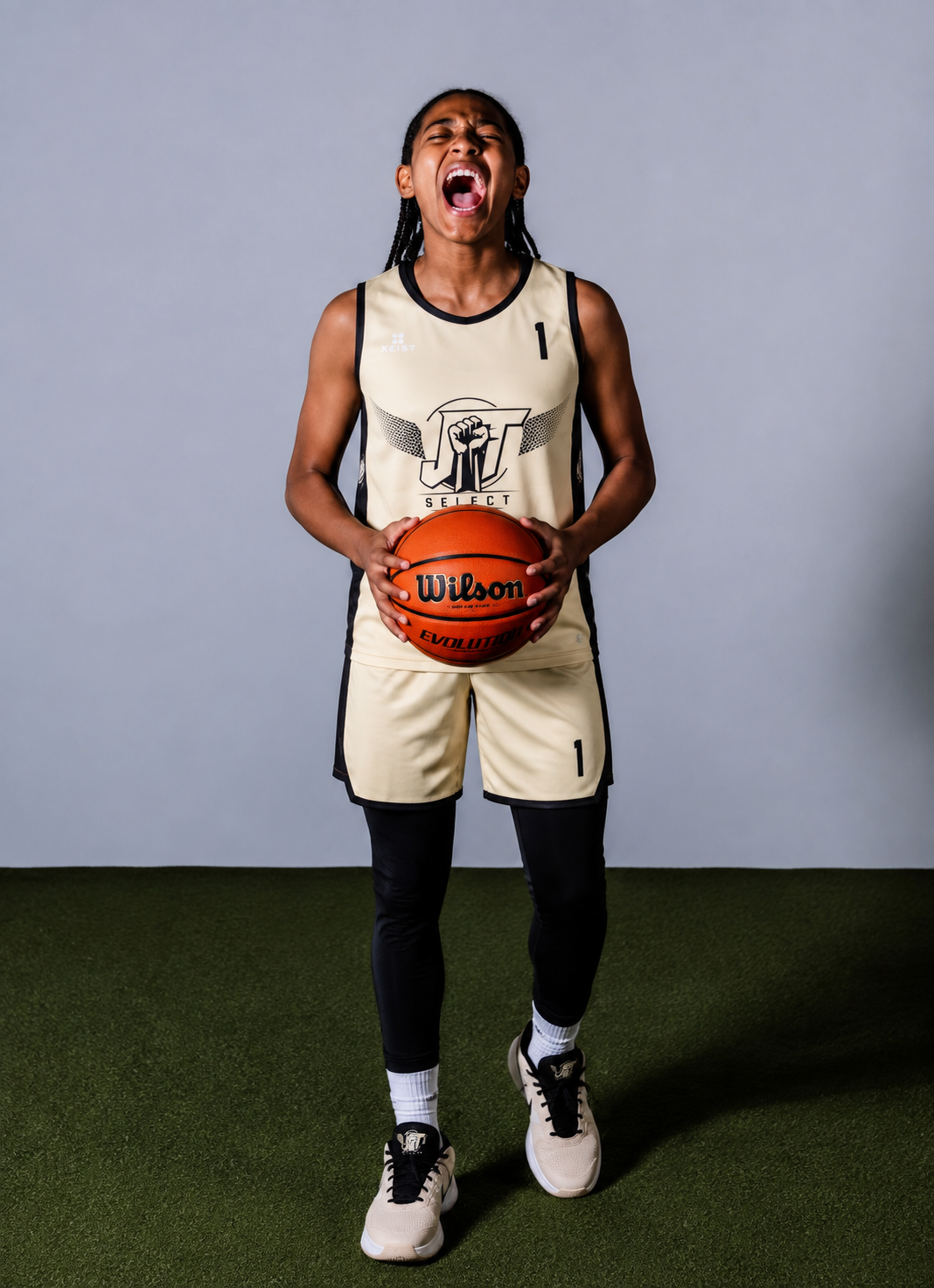 JT Select athlete holding a basketball